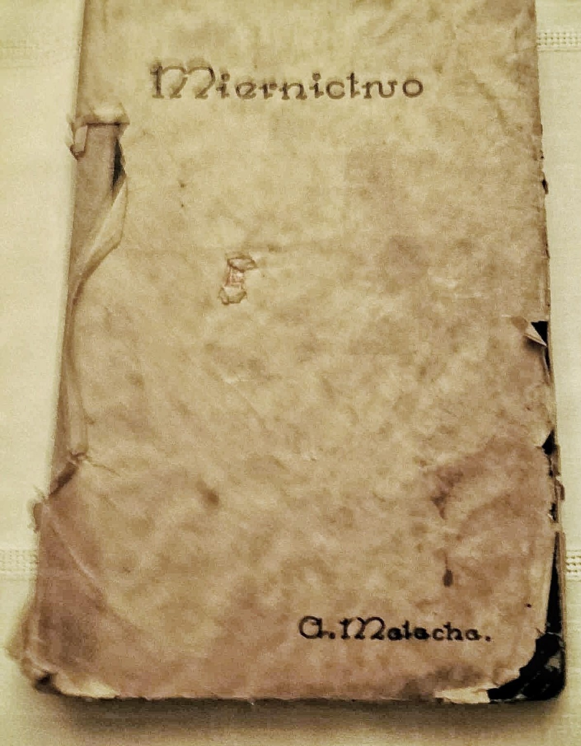 Zniszczona okładka z tytułem Miernictwo i podpisem A. Malacha.
